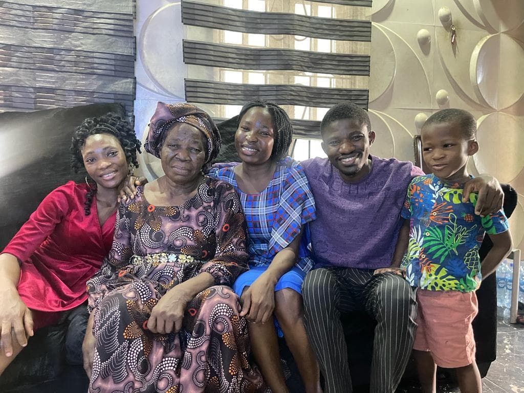 Deaconess Deborah Olubisi Oloyede seated closely with family members at home