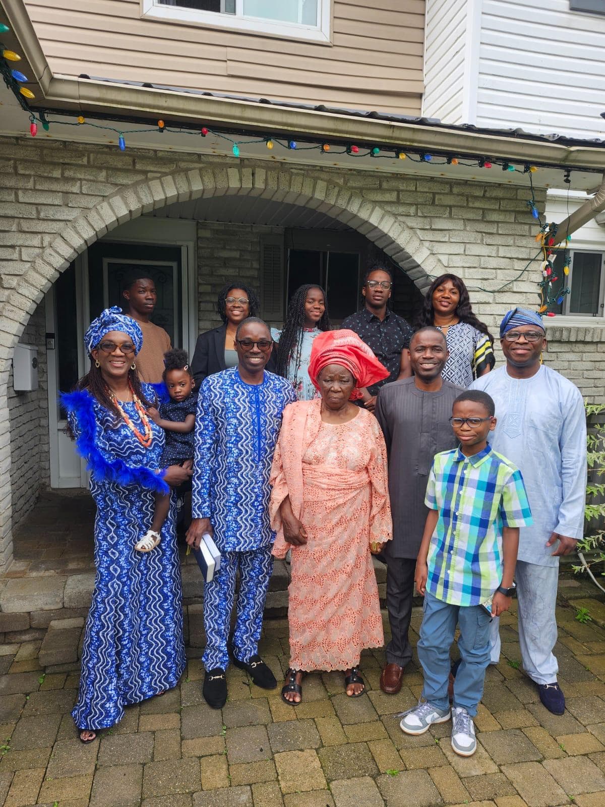 Deaconess Deborah Olubisi Oloyede standing outdoors with members of her family across generations