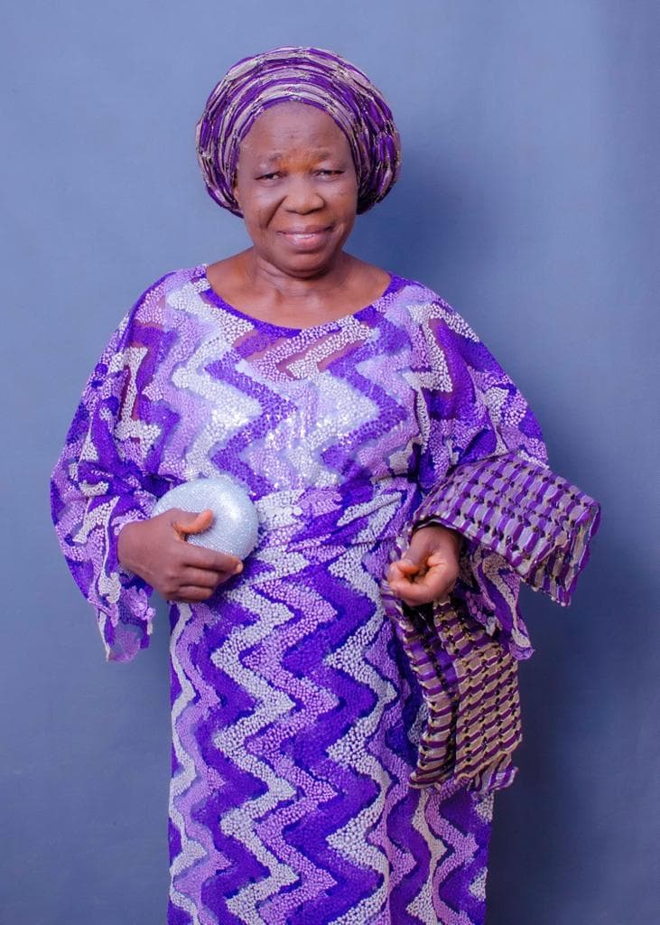 Deaconess Deborah Olubisi Oloyede smiling in purple traditional attire