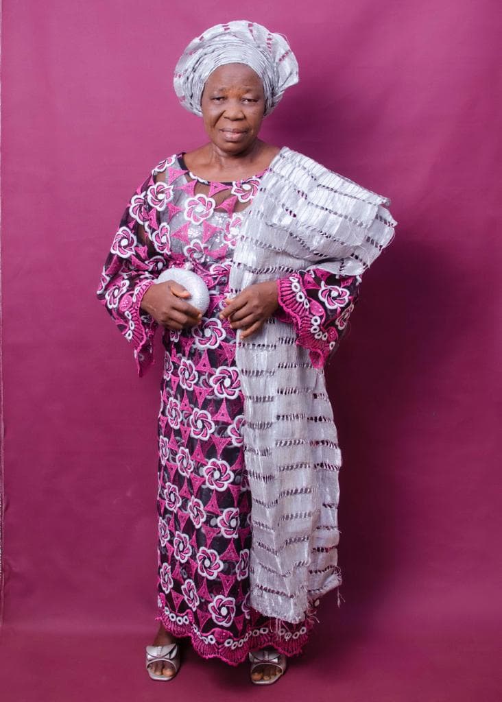 Deaconess Deborah Olubisi Oloyede in silver and magenta traditional attire