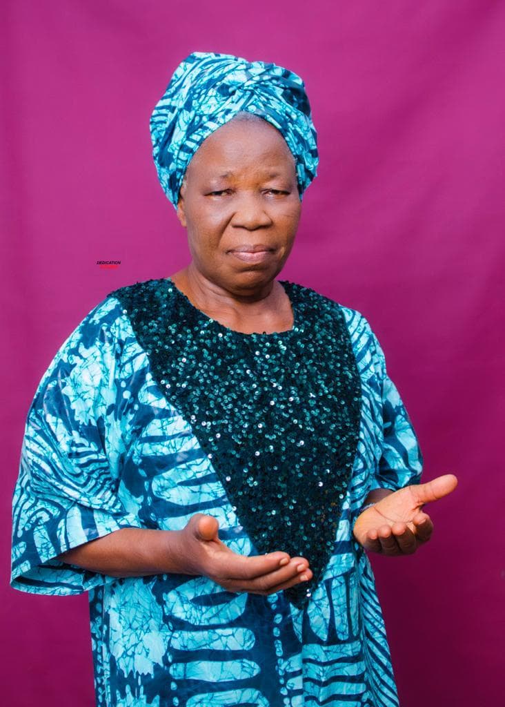 Deaconess Deborah Olubisi Oloyede in teal attire with open hands